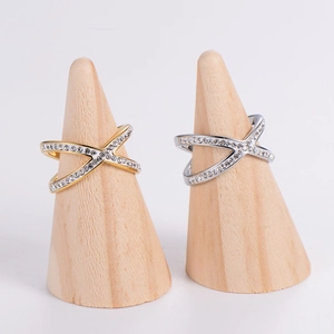 Crossed X-shaped rings in gold and silver finish with pave-set shimmering crystals