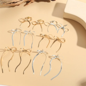 Elegant 14K gold and silver plated bow-shaped stud earrings in minimalist metal chain design
