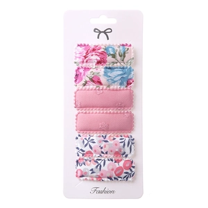 Close-up of 6-piece floral embroidery BB hair clips set on a professional white card