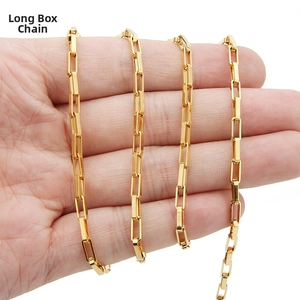 Detail of 18k gold plated stainless steel long box chain wrapped around hand