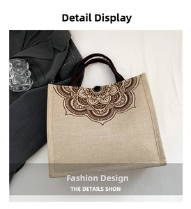 Close-up of linen tote bag featuring a brown mandala pattern and button closure