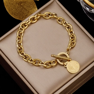Detail of gold coin pendant bracelet with OT clasp and Elizabeth II profile