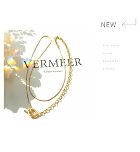 Close-up of 18k gold plated double layer chain necklace with OT toggle clasp detail