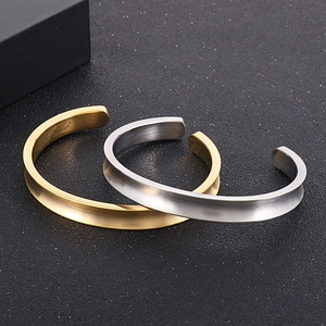 Minimalist concave stainless steel open bangles in gold and silver with brushed finish