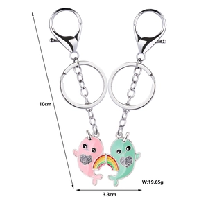 Detail view of narwhal couple keychains with 10cm total length and rainbow connector