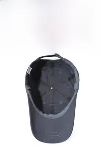 Detail of dark grey baseball cap interior showing breathable mesh and adjustable buckle