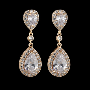 Luxurious gold teardrop dangle earrings with AAA cubic zirconia on black background