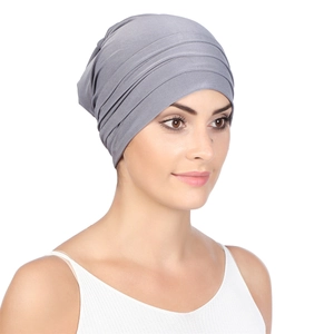 Front view of grey pleated turban hat with soft elastic fabric for women
