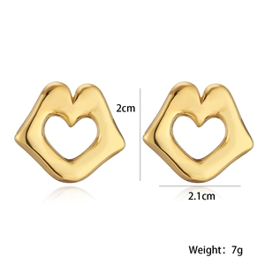Detailed view of gold lip earrings with heart cutout showing 2cm size and 7g weight