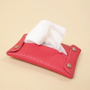 Portable red leather tissue holder bag with metal snap fastener and minimalist design