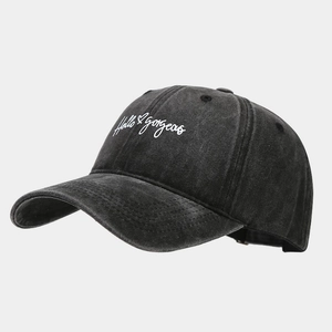 Detailed view of Hello Gorgeous embroidery on washed cotton vintage baseball cap