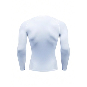 Detail view of white compression shirt back showing ergonomic seams and muscle fit