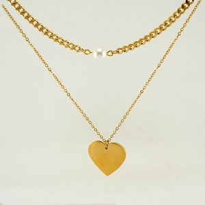 Double-layered gold necklace featuring white pearl accents and polished heart pendant