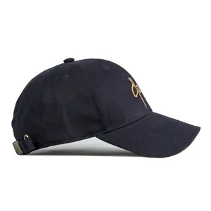 Navy blue cotton baseball cap with gold embroidery and adjustable metal buckle
