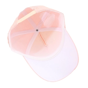 Pink baseball cap with white brim showing interior stitching and adjustable strap