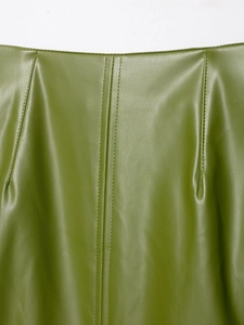 Detailaufnahme von grasgrünem PU-Leder mit präzisen Nähten und feiner Textur