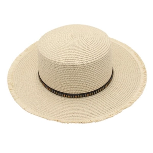 Detail of a beige flat top straw boater hat featuring pearl beads and frayed edge brim
