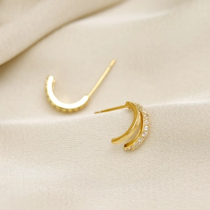 Exquisite gold C-shaped 925 silver stud earrings with paved white zircon stones