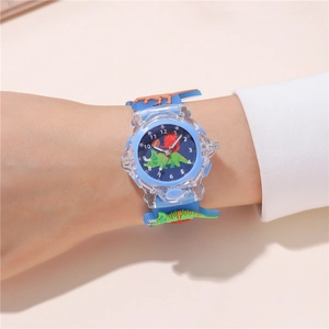 Close-up of blue kids dinosaur quartz watch with cartoon silicone strap on wrist
