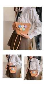 Detail of hand-woven straw crossbody bag featuring colorful crochet flower embellishments