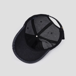 Internal structure of denim baseball cap showing reinforced seams and sweatband details
