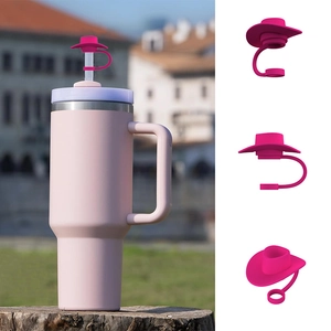 Detailed view of pink silicone cowboy hat straw cover on a large tumbler with handle