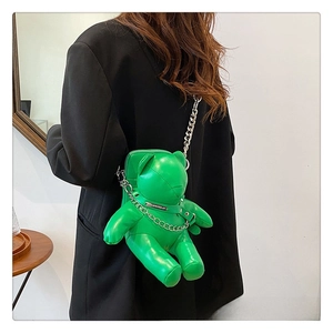 Detailed back view of green PU leather bear crossbody bag with silver metal chain straps