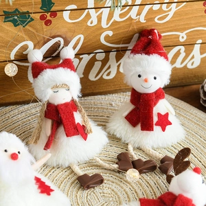 Plush Christmas hanging ornaments featuring snowman, elk and girl figures on wood background