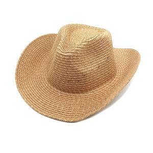 Détail macro de la texture en paille de papier tissée et du large bord du chapeau de cowboy