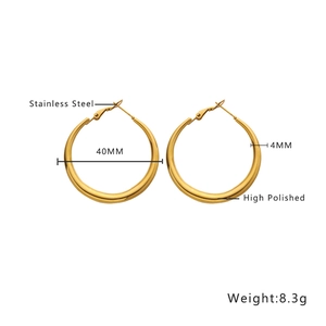 Macro detail of 40mm gold-plated hollow hoop earrings showing polished stainless steel finish