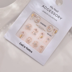 Close-up of MJ-031 3D nail art accessories with gold frames and sparkling rhinestones