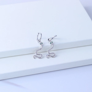 Silver snake earrings in 18K gold plated stainless steel with white zircons and green eyes