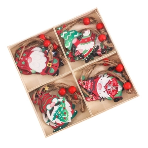Set of 12 festive wooden Christmas gnome hanging ornaments in a grid display box