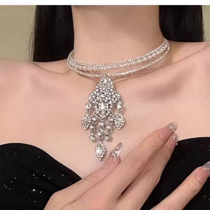 Detail shot of luxury layered choker necklace with rhinestones and faux pearls