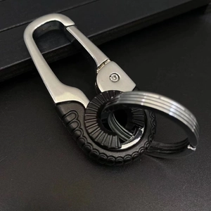 Executive silver metal car keychain with a textured black grip and dual ring design