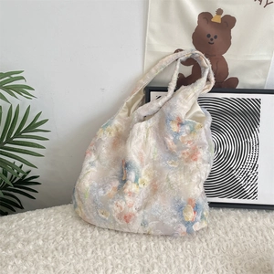 Detail of floral chiffon tote bag featuring soft fringe texture and tulip pattern