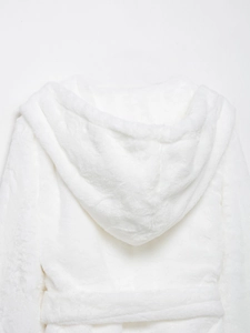 Close-up of the plush texture and hood design of the white faux fur belted coat