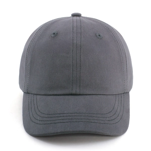 Detail of dark grey kids baseball cap featuring cotton twill texture and stitching