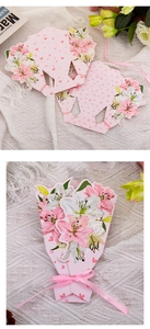 Detail of pink floral thank you cards with ribbon bows and gold foil lettering