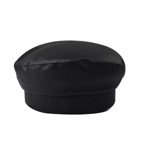 Close-up of black PU leather beret showing detailed crocodile skin texture and stitching