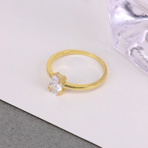Macro shot of gold-plated S925 silver ring featuring an oval diamond and hallmark