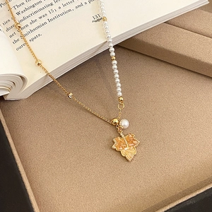 18K gold-plated maple leaf necklace with white pearls and sparkling amber zircons