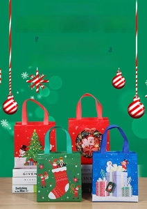 Close-up of Christmas non-woven gift bags with festive tree, snowman and nutcracker prints