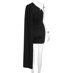 Detail of black one-shoulder dress featuring long cape and elegant side ruching