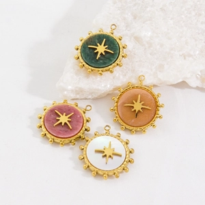 Luxurious stainless steel star pendants with colorful gemstones on white stone base