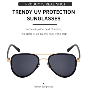 Close-up of golden nose pads and sturdy bridge of black polarized aviator sunglasses