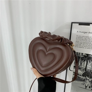 Vintage heart shaped dark brown crossbody bag with ruffled handle and textured leather