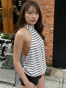 Chic black and white striped halter knit vest top featuring an open back design