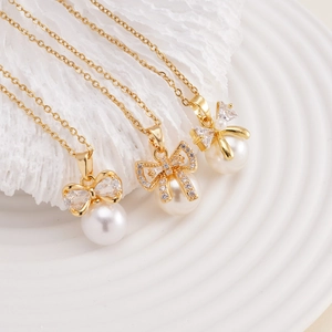 Elegant gold bow necklace with sparkling zircon and white pearl pendant for women