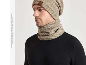 Detail of khaki knit beanie and neck warmer set with quilted texture and leather logo patch